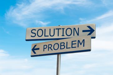 Solution or Problem - a picture of a sign reading "Solution" pointing one direction, and another sign reading "Problem" pointing to opposite direction.